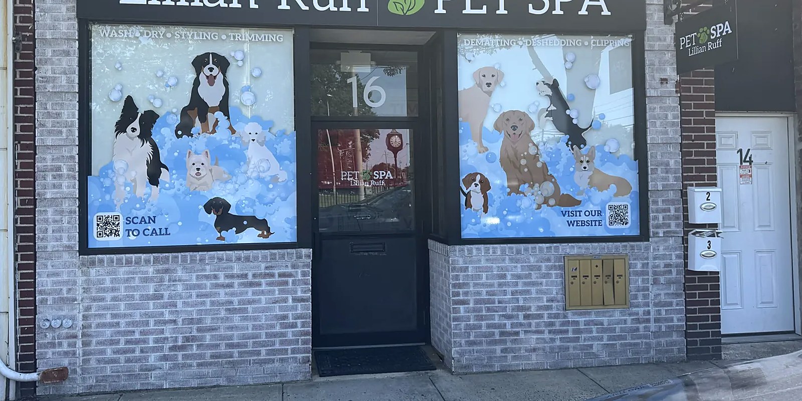 A groomer running clippers along a dog's back at the Lillian Ruff Pet Spa grooming table in East Northport, New York
